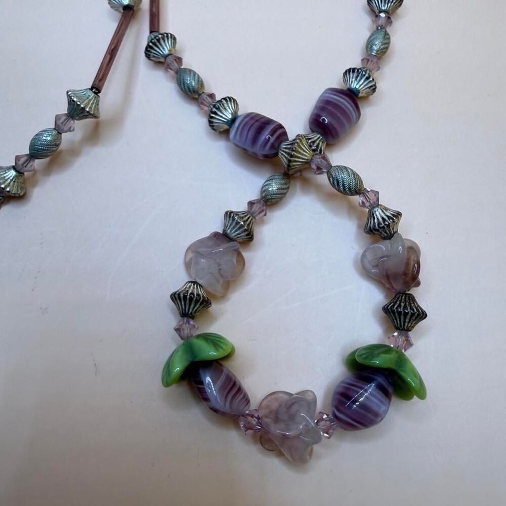 Purple and green glass beaded necklace with flower beads